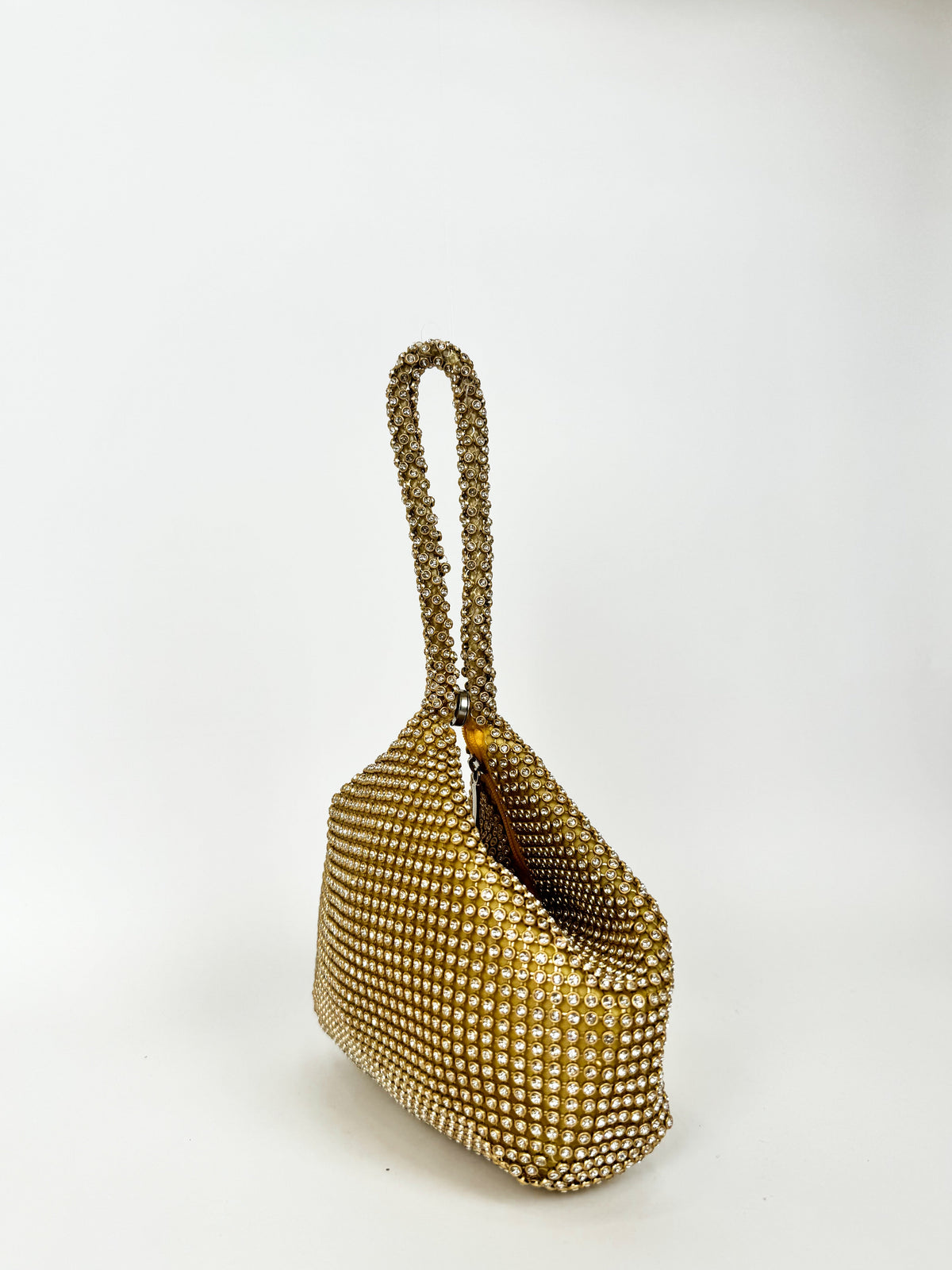 Bolsa de mão com brilhos dourados