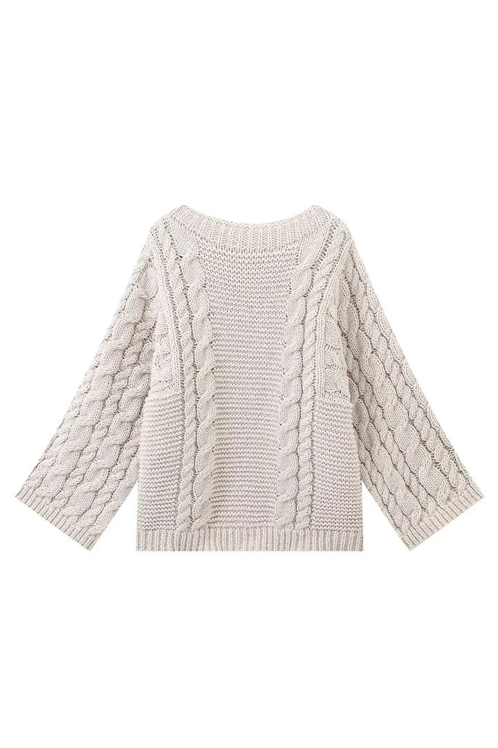 Jersey oversize de punto trenzado con cuello alto y mangas acampanadas